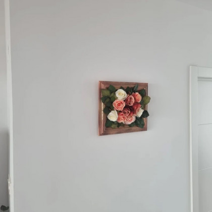 Restored picture frame with artificial flowers
