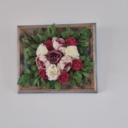 Restored picture frame with artificial flowers